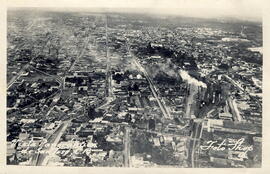 Fotografía panorámica del lado Noroeste de la Ciudad San José . Se observa humo, el cual indica l...