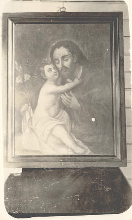 Fotografía de un cuadro con la imagen religiosa de San José y el niño Dios, que hasta 1927 la fam...